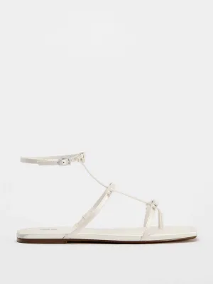 Flat sandals with tied straps