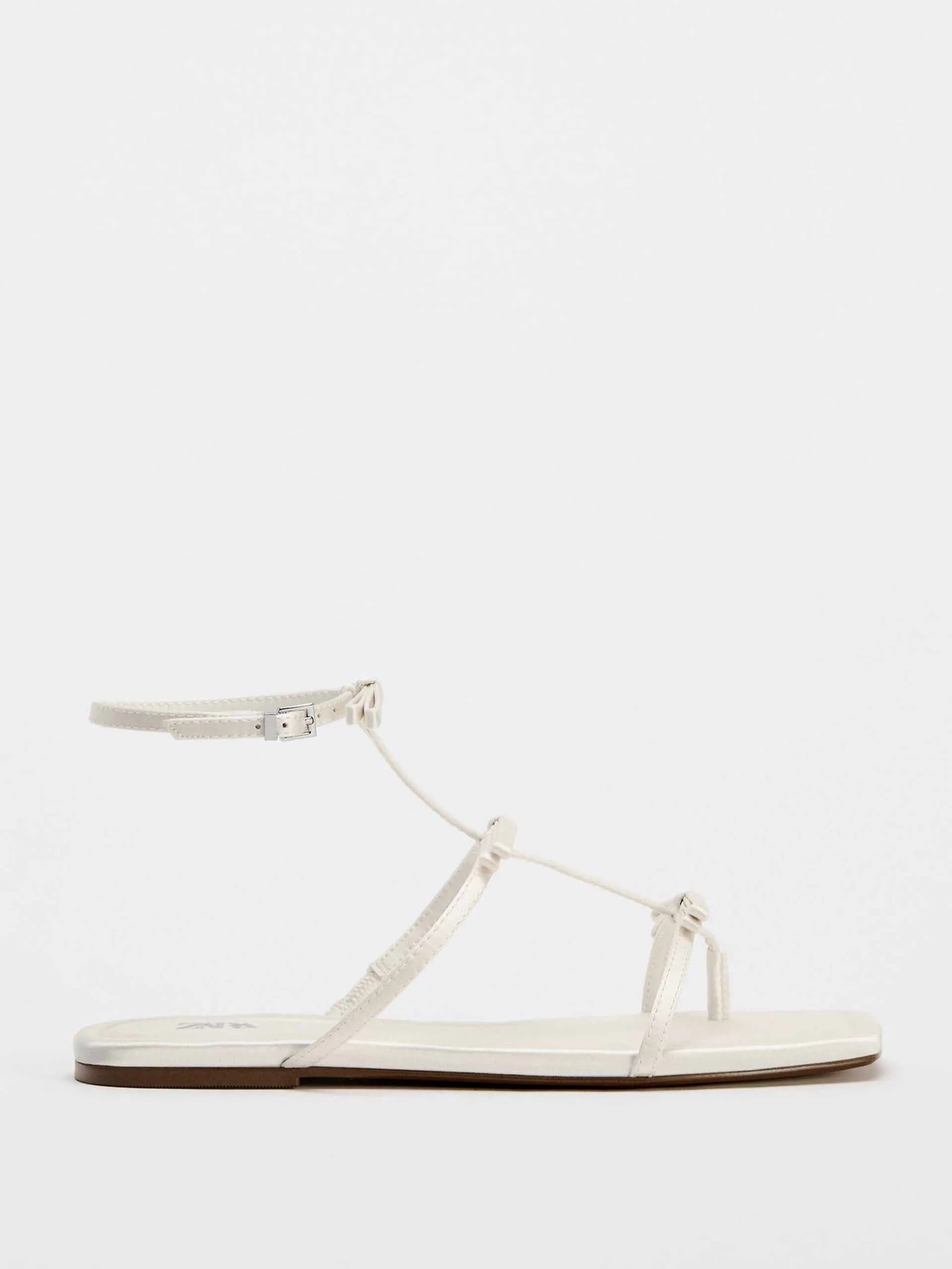 Flat sandals with tied straps